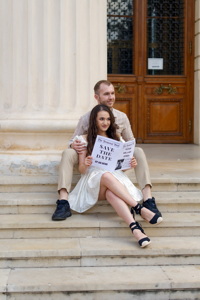 Young couple posing on stairs